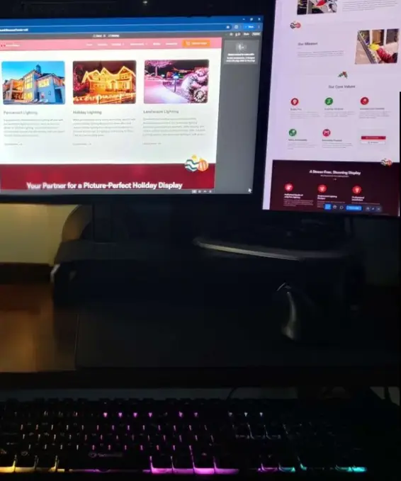 Joseph Ventiro's web development workspace with dual monitors displaying website projects.